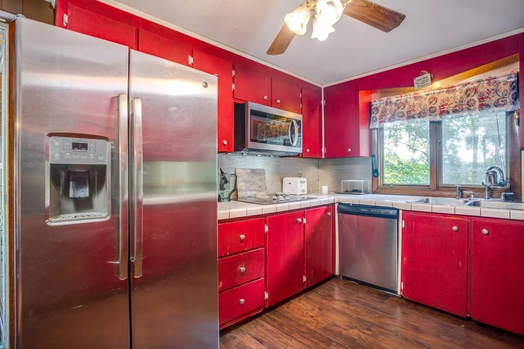 21 Tanner Road Webster, MA 01570 - Photo 13 of 26 a kitchen with sink cabinets and window