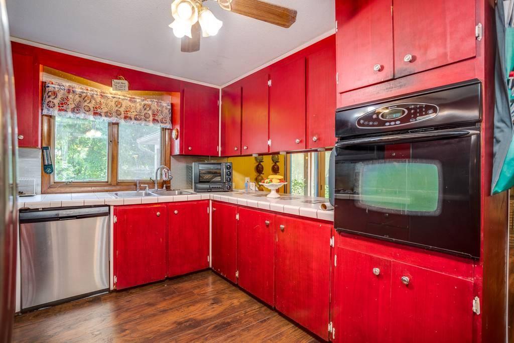 21 Tanner Road Webster, MA 01570 - Photo 14 of 26 a kitchen with stainless steel appliances granite countertop a stove a sink and a microwave