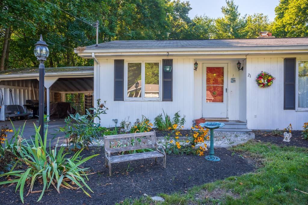 21 Tanner Road Webster, MA 01570 - Photo 2 of 26 a view of a house with a yard and sitting area