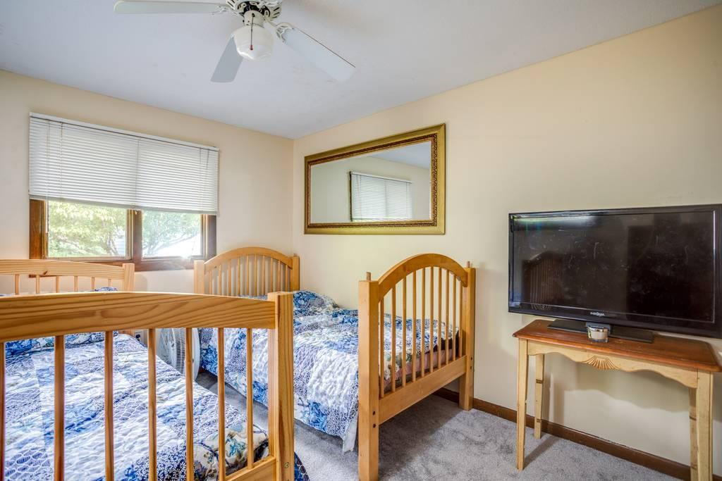 21 Tanner Road Webster, MA 01570 - Photo 22 of 26 a bedroom with furniture and a flat screen tv