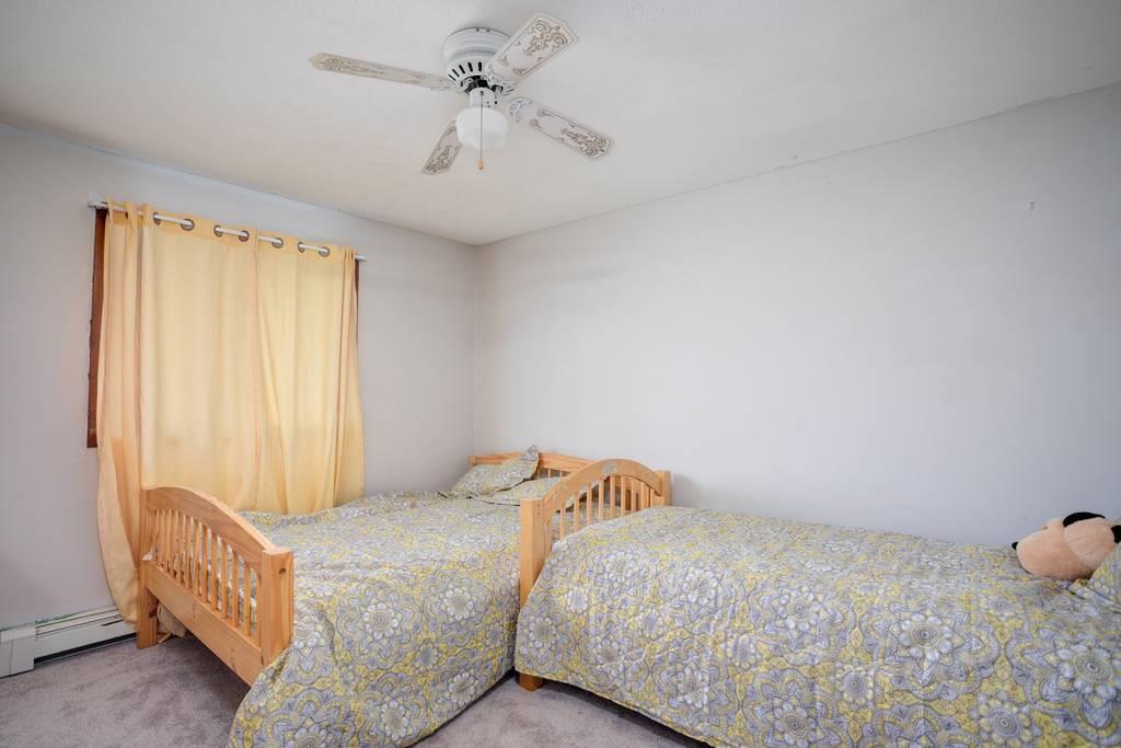 21 Tanner Road Webster, MA 01570 - Photo 23 of 26 a bedroom with a bed and a window