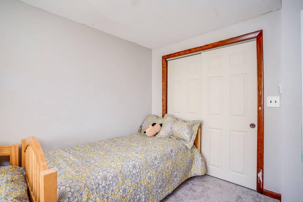 21 Tanner Road Webster, MA 01570 - Photo 24 of 26 a bedroom with a bed and a window