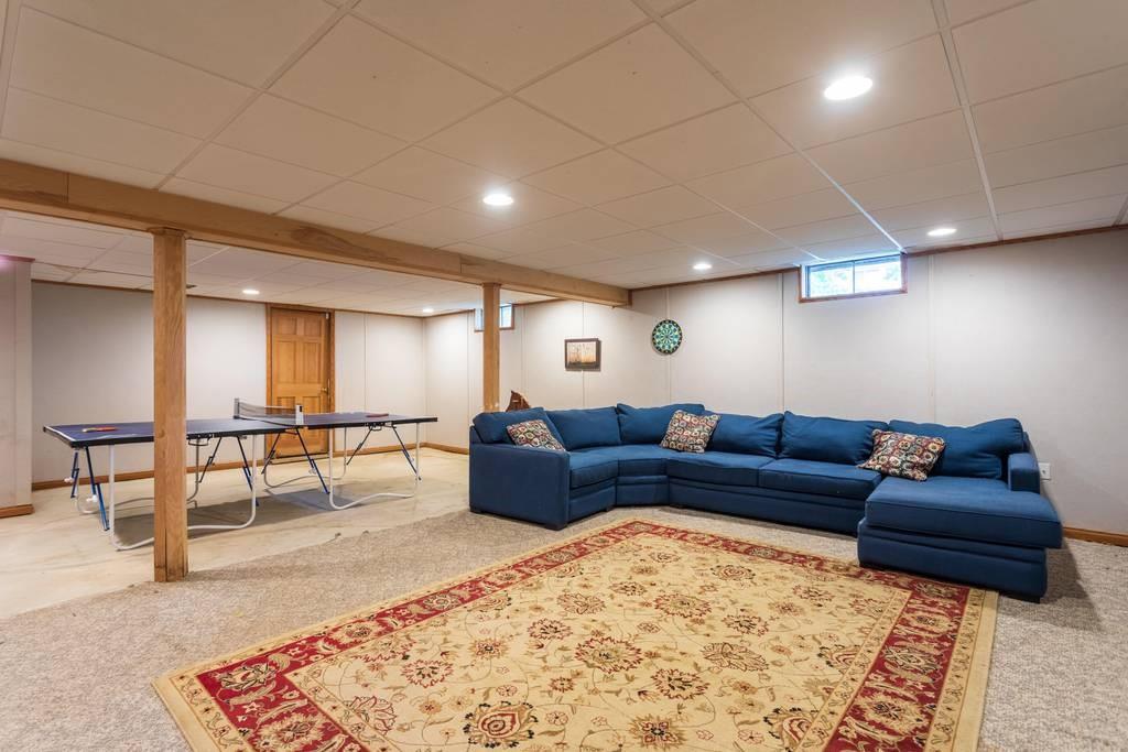 21 Tanner Road Webster, MA 01570 - Photo 25 of 26 a living room with furniture and a rug