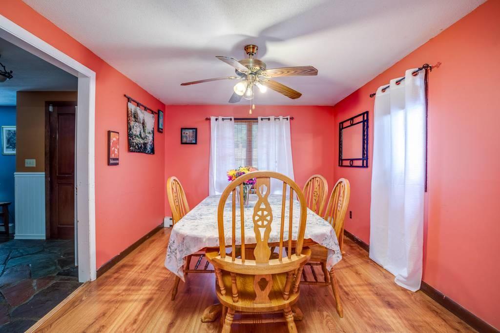 21 Tanner Road Webster, MA 01570 - Photo 6 of 26 a view of a dining room with furniture window and wooden floor