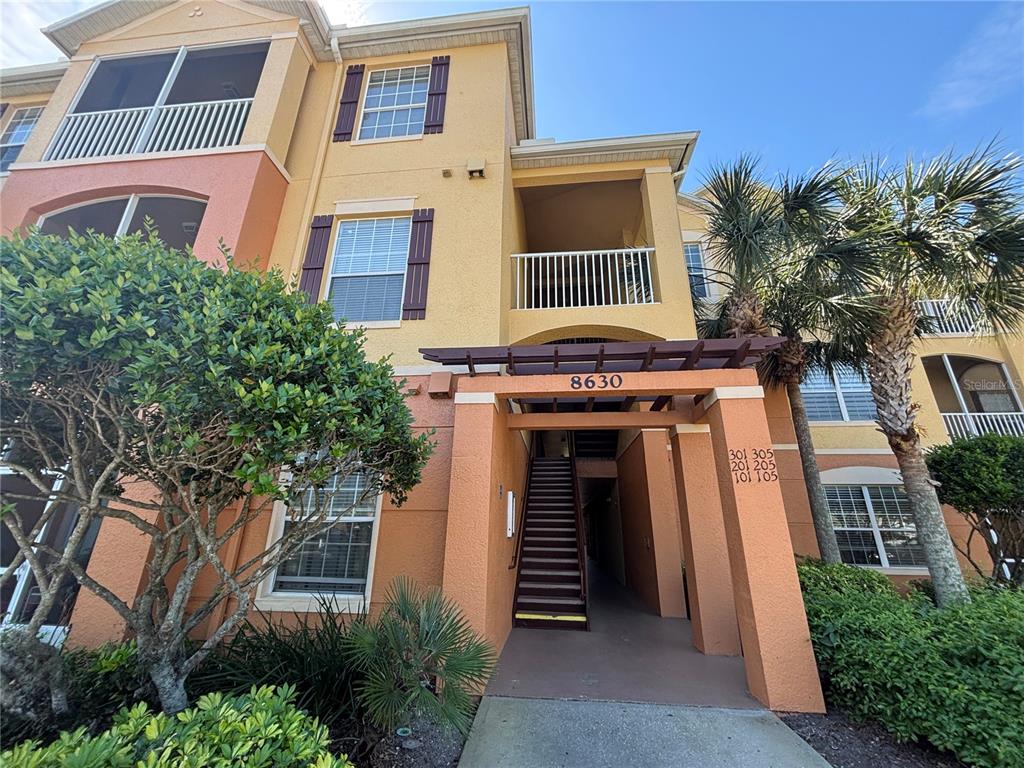 Undisclosed Address Orlando, FL 32829 - Photo 1 of 1 a front view of a house with a yard