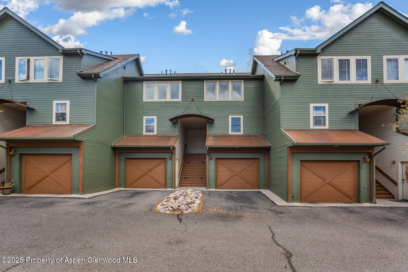 a front view of a house with a garage