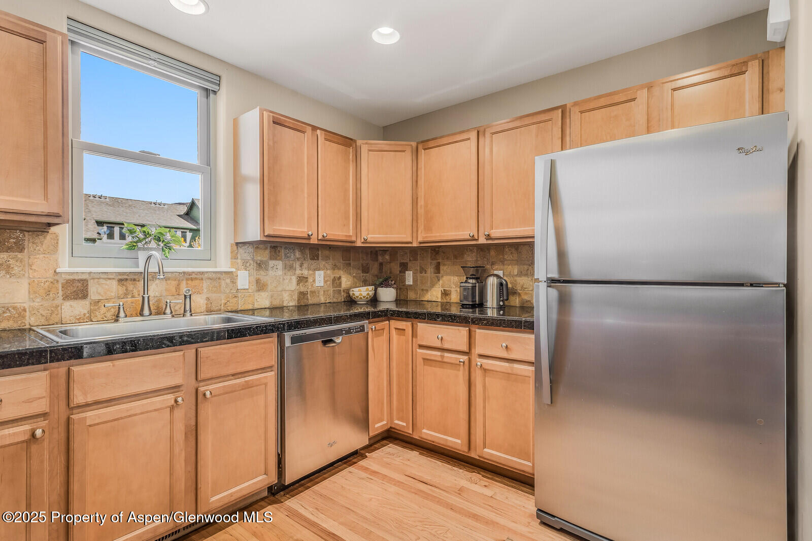 113 Lakeside Court Basalt, CO 81621 - Photo 12 of 39 a kitchen with stainless steel appliances granite countertop a refrigerator sink and cabinets