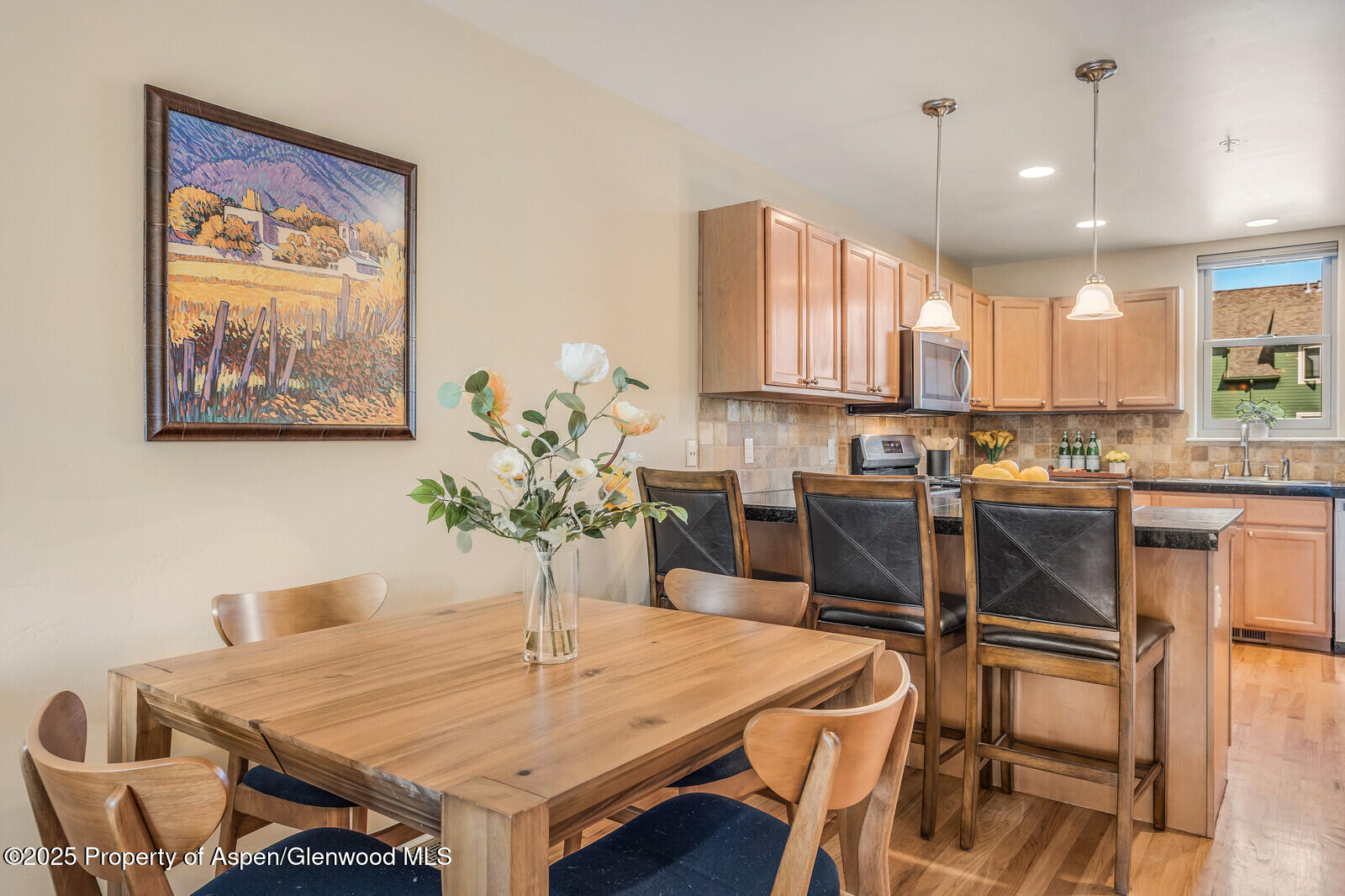 113 Lakeside Court Basalt, CO 81621 - Photo 14 of 39 a kitchen with a table chairs sink and cabinets