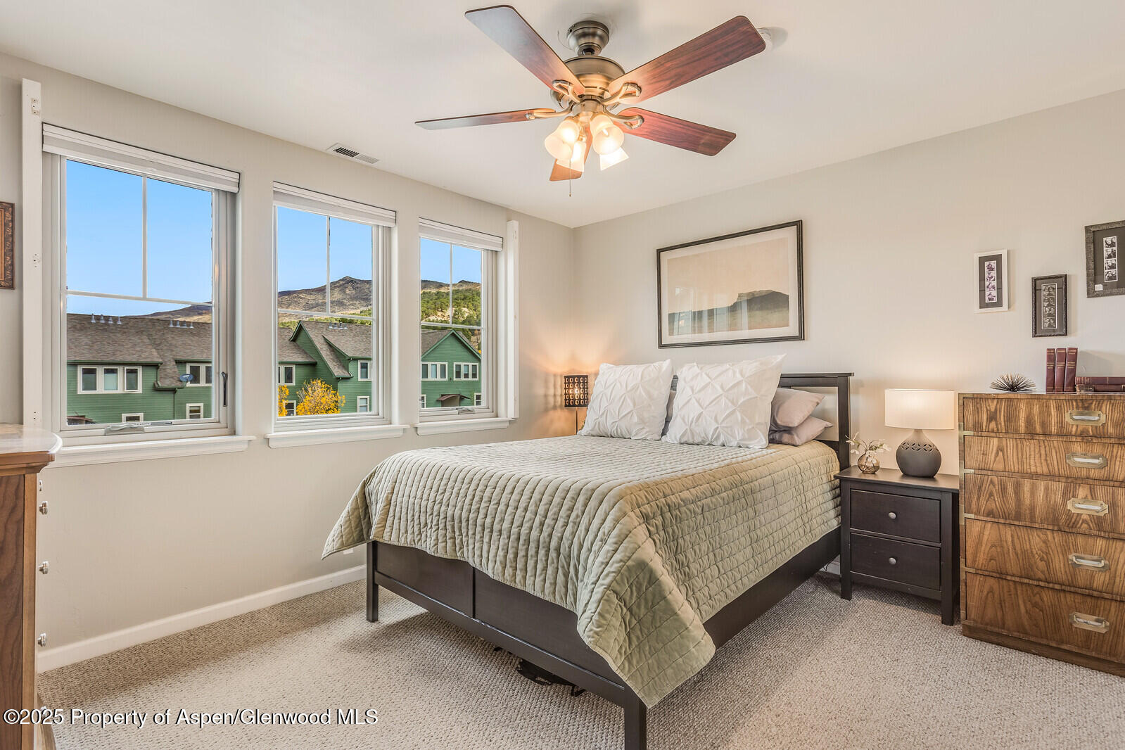 113 Lakeside Court Basalt, CO 81621 - Photo 17 of 39 a bedroom with a bed chandelier and window