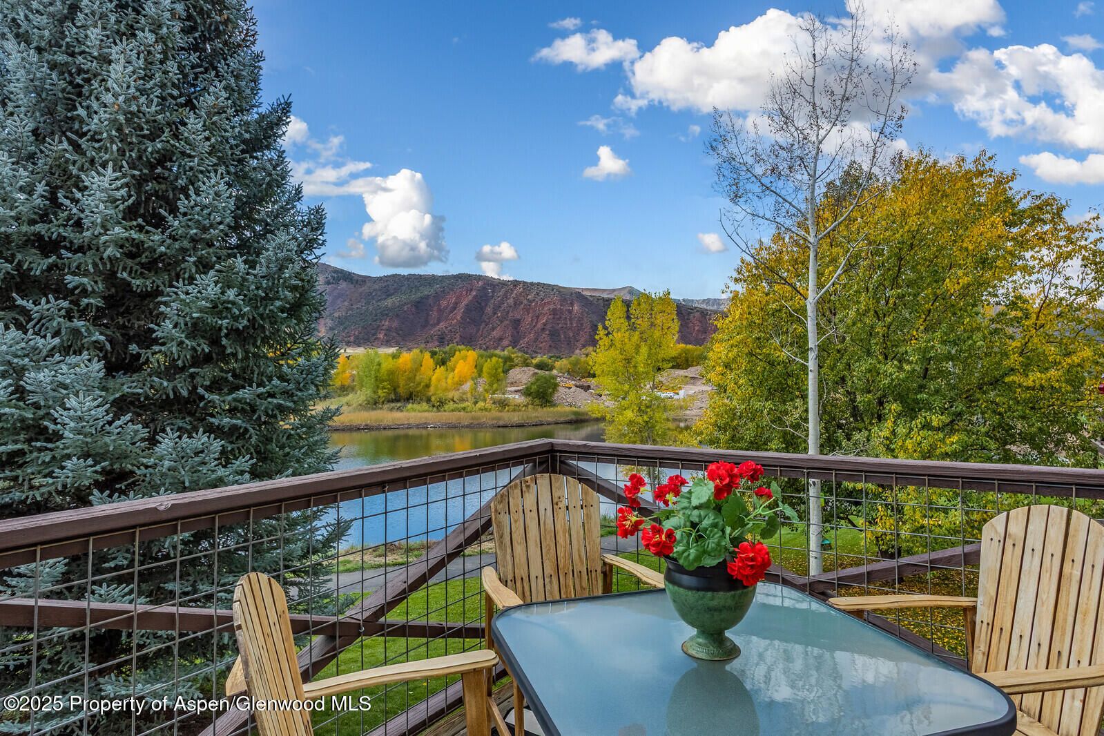 113 Lakeside Court Basalt, CO 81621 - Photo 2 of 39 a view of a balcony with wooden chairs