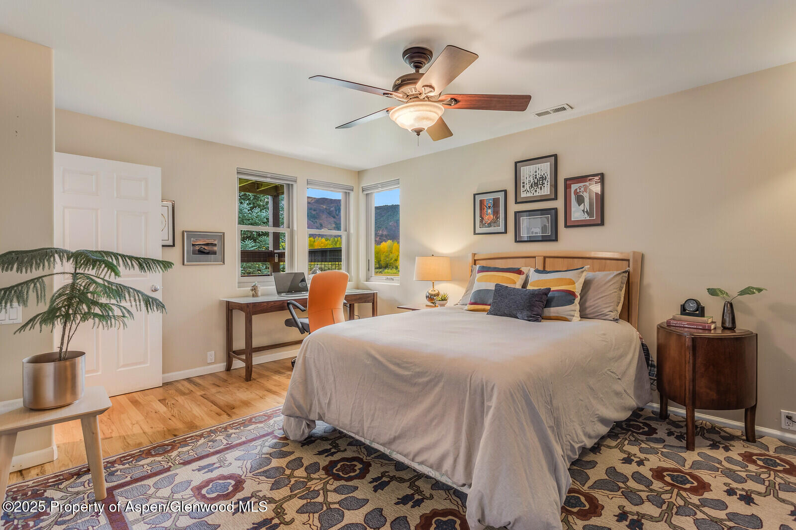 113 Lakeside Court Basalt, CO 81621 - Photo 23 of 39 a bedroom with a bed and a table in it