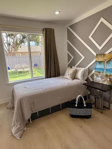 a bedroom with a bed and a table