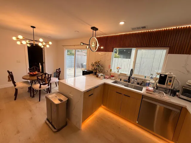 a kitchen with sink cabinets and outdoor living room