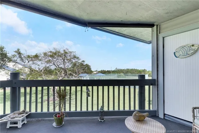 a balcony with chairs
