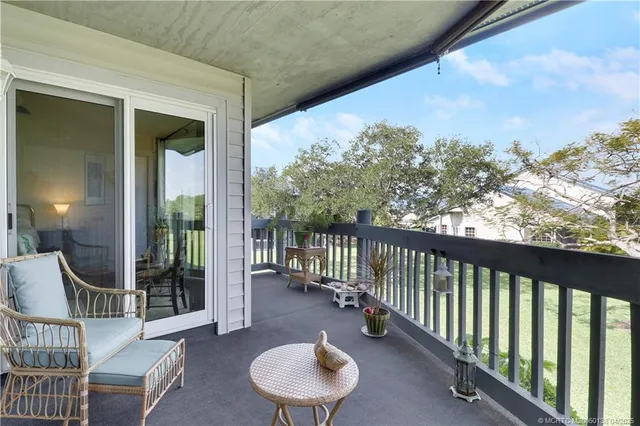 a balcony with chairs