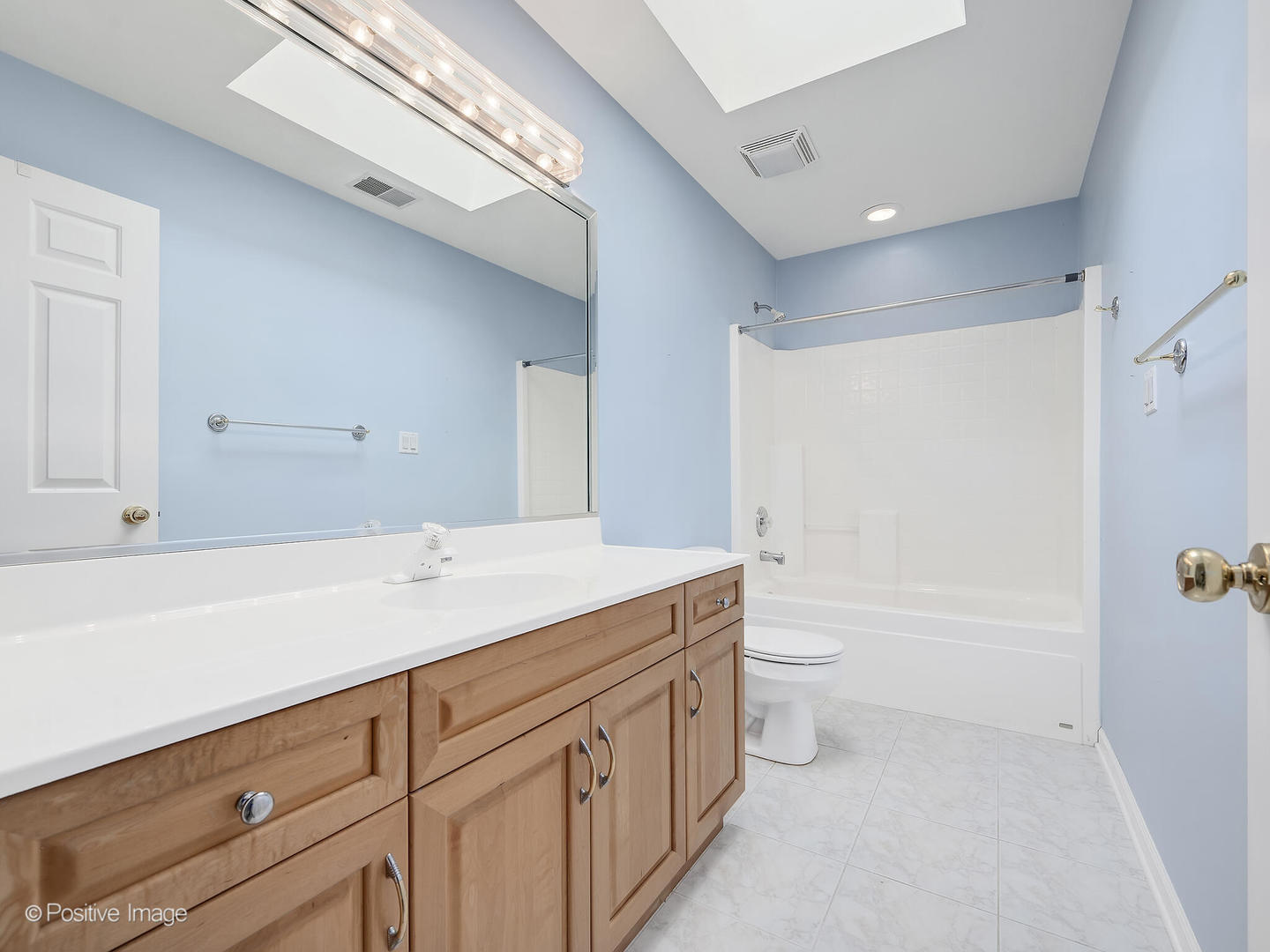 1332 Arbor Drive Lemont, IL 60439 - Photo 21 of 31 a bathroom with a granite countertop sink a toilet and shower
