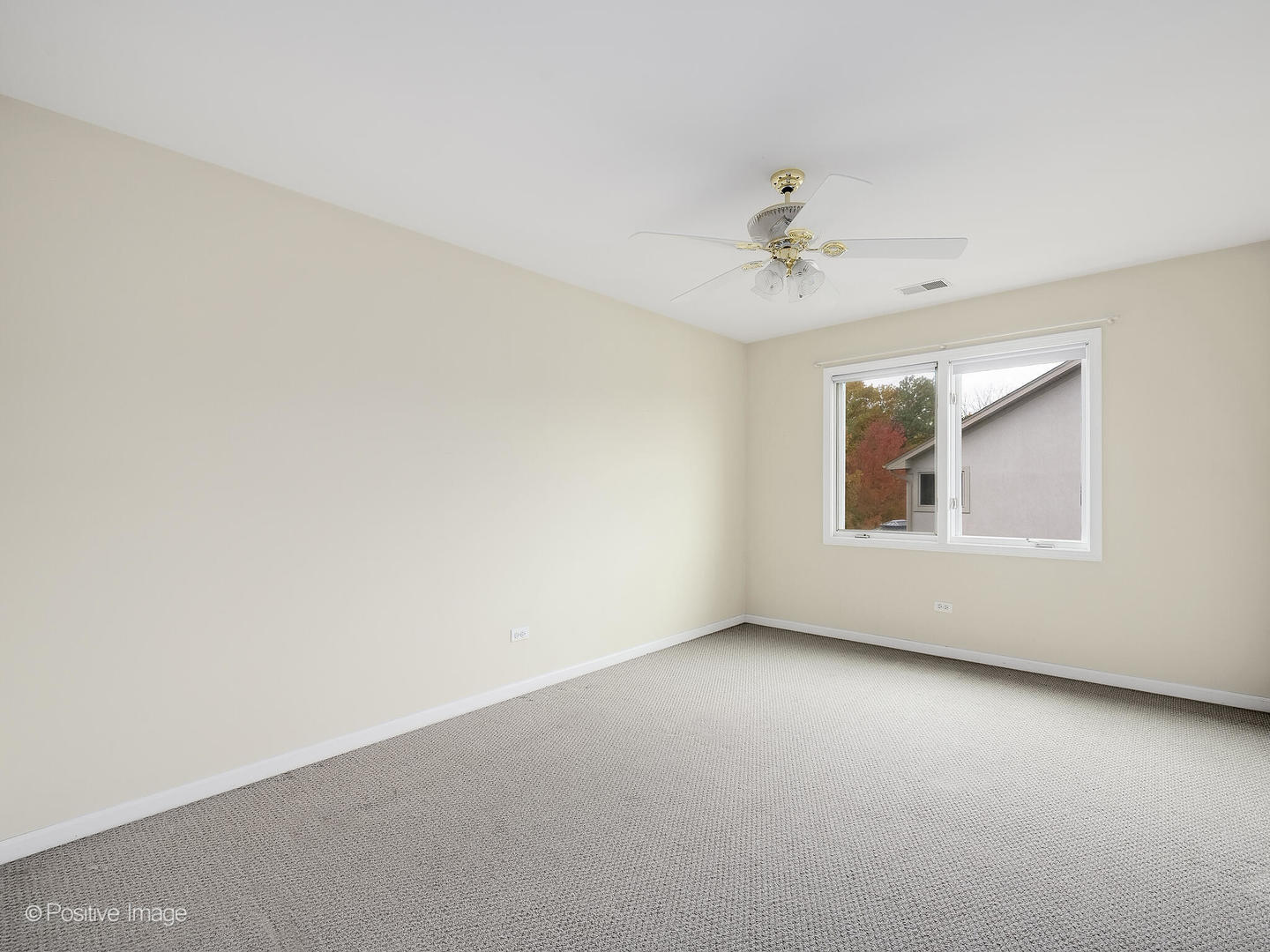 1332 Arbor Drive Lemont, IL 60439 - Photo 23 of 31 an empty room with a window and a ceiling fan
