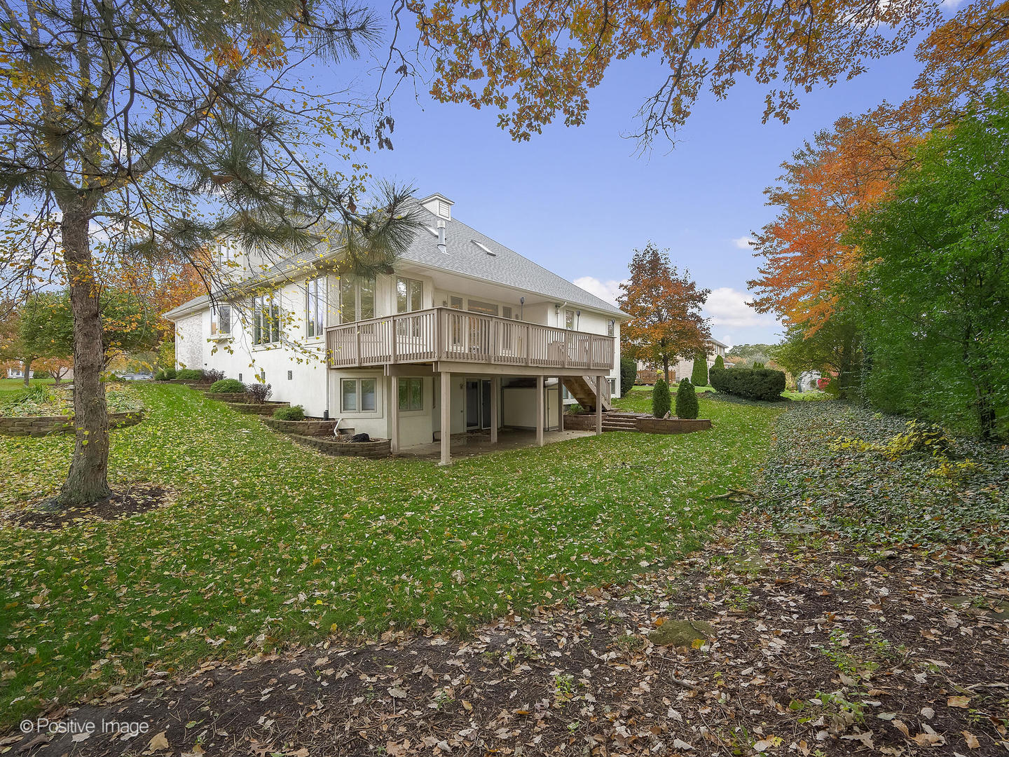 1332 Arbor Drive Lemont, IL 60439 - Photo 31 of 31 a view of a house with a big yard and large trees