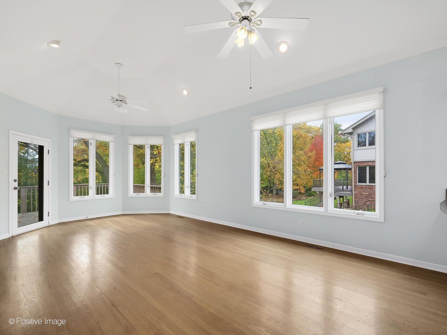 1332 Arbor Drive Lemont, IL 60439 - Photo 7 of 31 a view of an empty room with wooden floor and a window