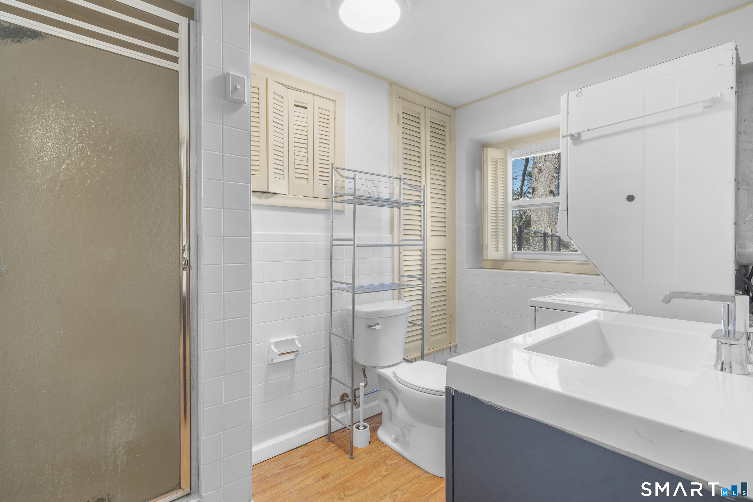 9 Daniel Road, Unit 9B Bristol, CT 06010 - Photo 6 of 16 a bathroom with a sink toilet and shower