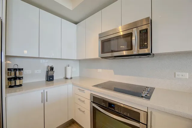 a kitchen with a stove and a microwave