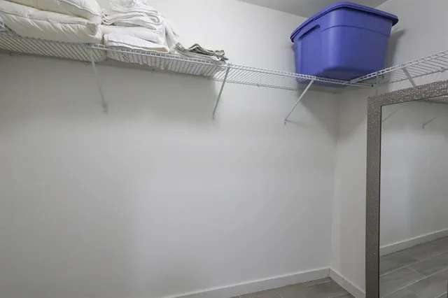 a room with a cabinet and a table