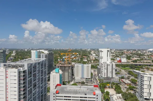 a view of a city with tall buildings