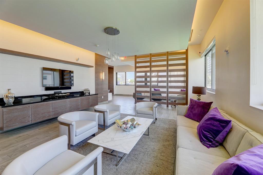 999 Southwest 1st Avenue, Unit 2913 Miami, FL 33130 - Photo 25 of 36 a living room with furniture and a flat screen tv