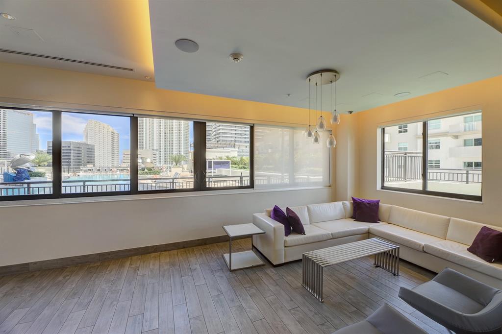 999 Southwest 1st Avenue, Unit 2913 Miami, FL 33130 - Photo 26 of 36 a living room with furniture and a large window