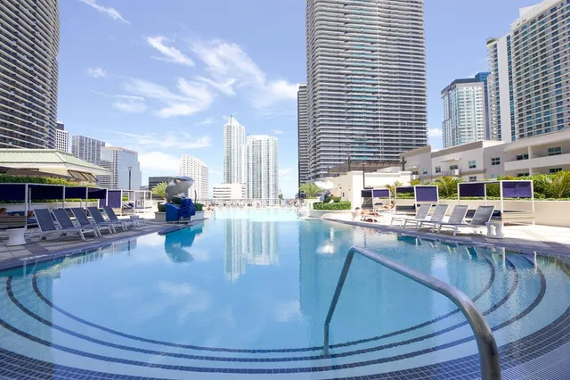 a dining table with chairs and window