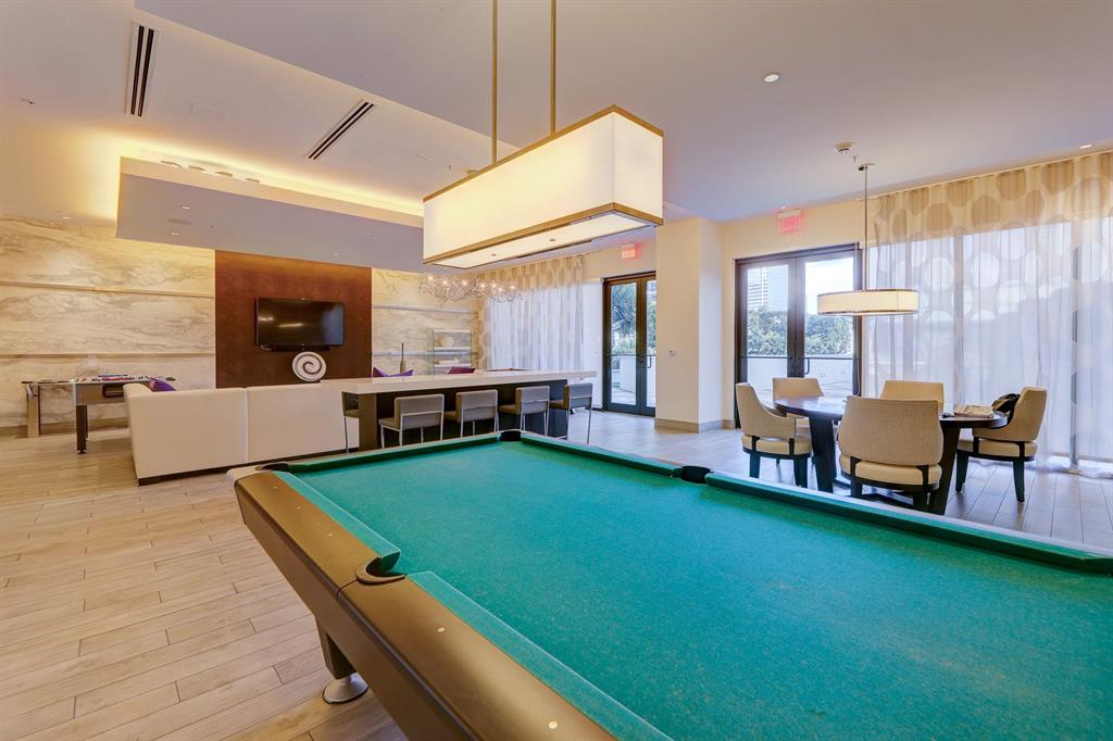 999 Southwest 1st Avenue, Unit 2913 Miami, FL 33130 - Photo 35 of 36 a room with pool table and windows