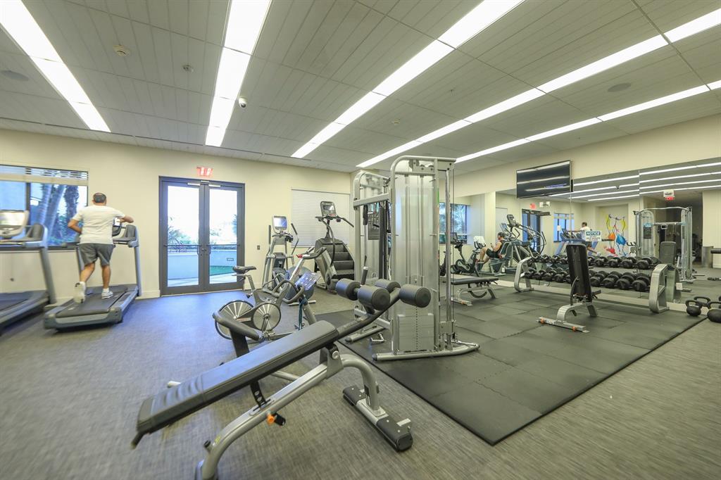 999 Southwest 1st Avenue, Unit 2913 Miami, FL 33130 - Photo 36 of 36 a room with gym equipment and floor to ceiling window