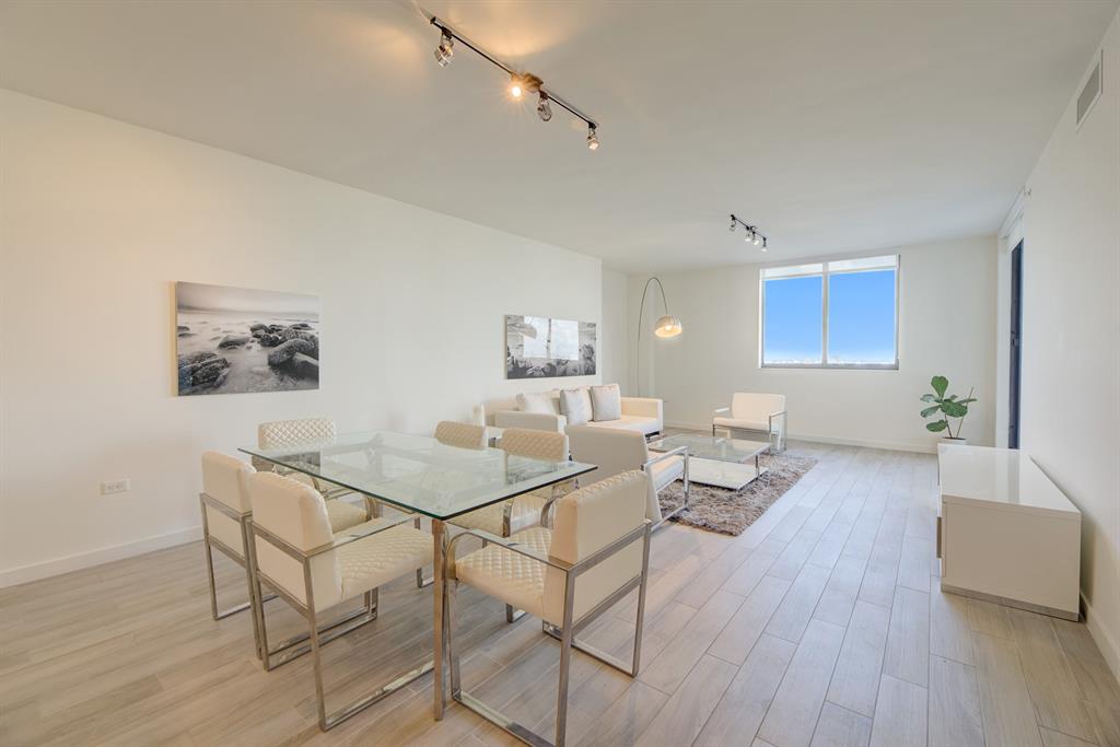 999 Southwest 1st Avenue, Unit 2913 Miami, FL 33130 - Photo 5 of 36 a living room with furniture and wooden floor