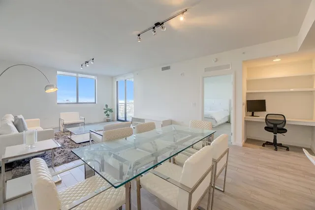 a living room with furniture and a table