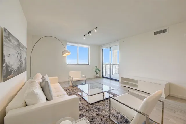 a living room with furniture and a window