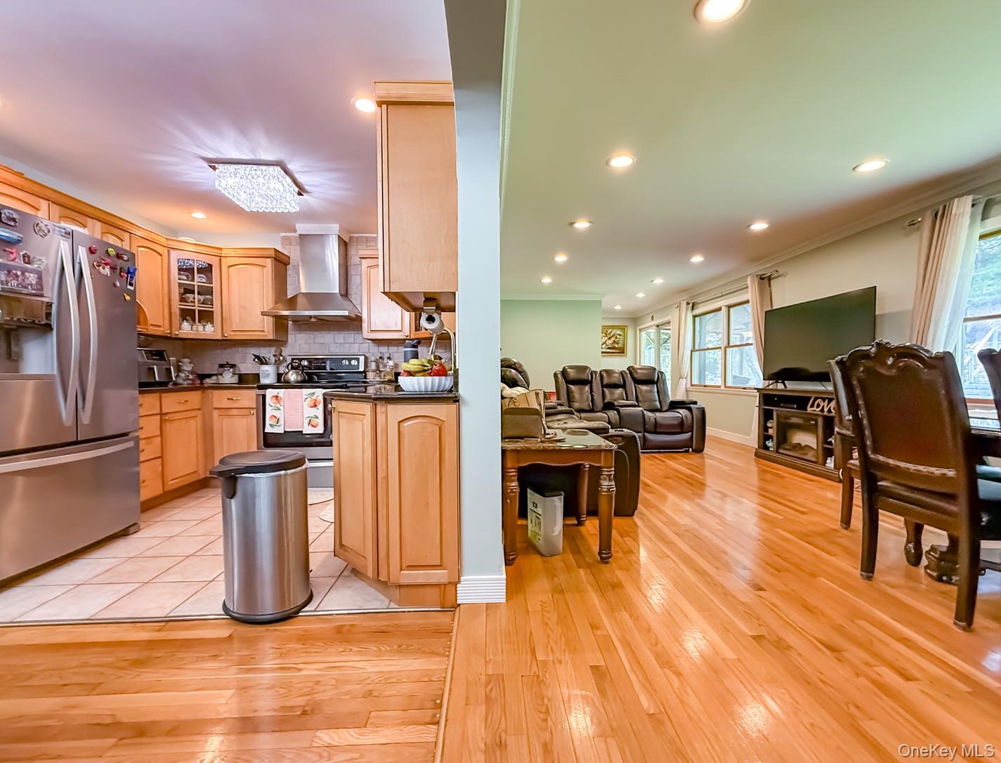 49 Meadow Road Montrose, NY 10548 - Photo 12 of 50 Open concept living area featuring wood-finish flooring, recessed lighting, and large windows