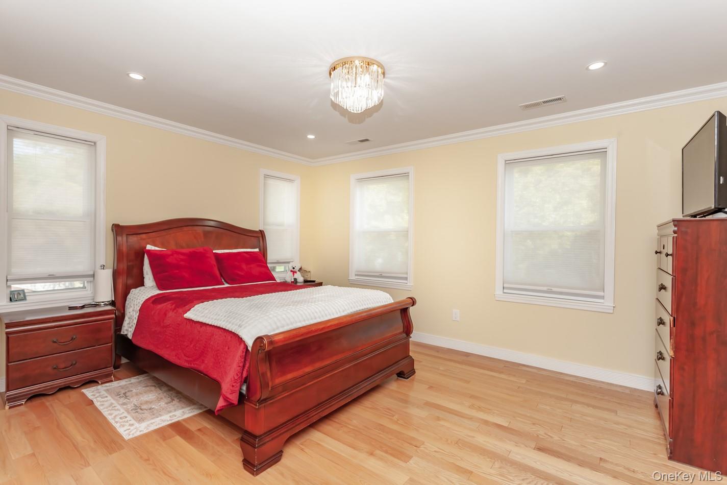 49 Meadow Road Montrose, NY 10548 - Photo 17 of 50 Bedroom featuring wood-finish flooring, recessed lighting, and crown molding