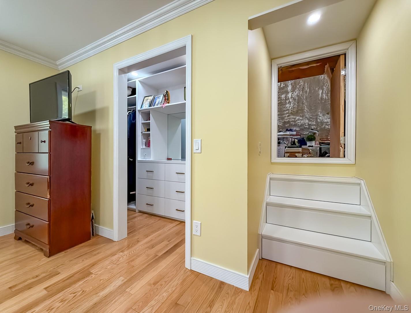 49 Meadow Road Montrose, NY 10548 - Photo 19 of 50 Hardwood flooring throughout the room, complemented by white crown molding and baseboards