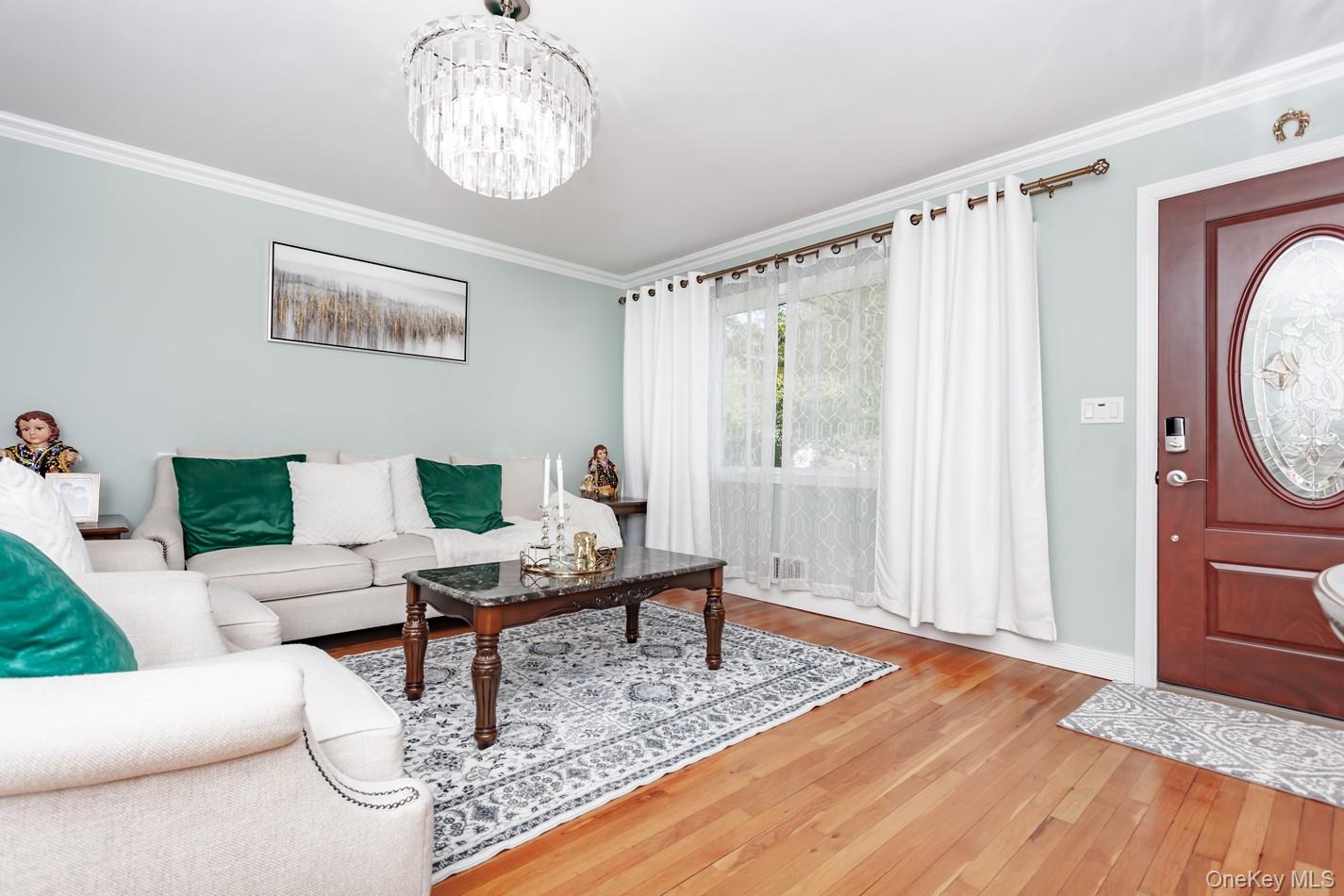 49 Meadow Road Montrose, NY 10548 - Photo 6 of 50 Living area featuring hardwood flooring and crown molding