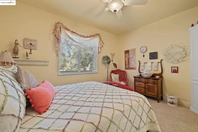 a bedroom with a large bed and a dresser