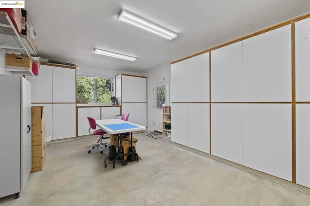 a workspace with furniture and windows