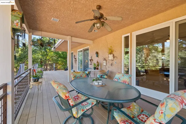 a dining room with furniture wooden floor a chandelier