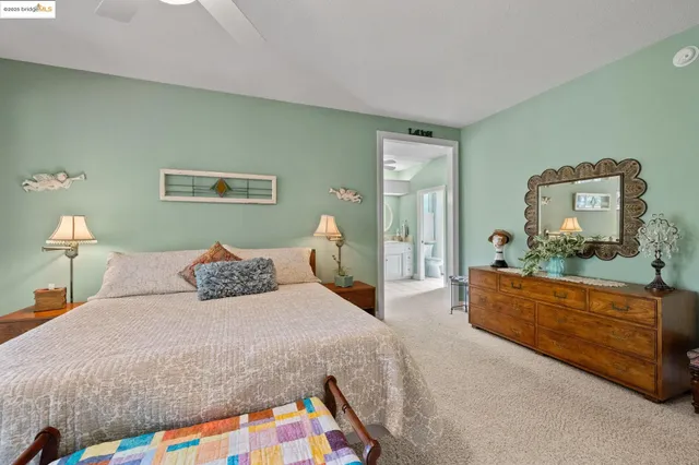 a bedroom with a bed and a dresser in it