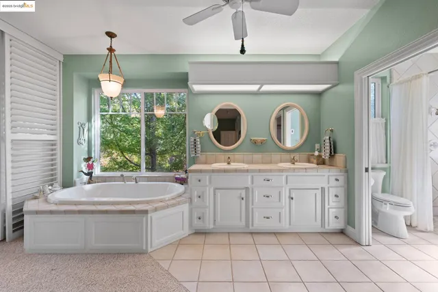 a bathroom with a sink a mirror and bathtub