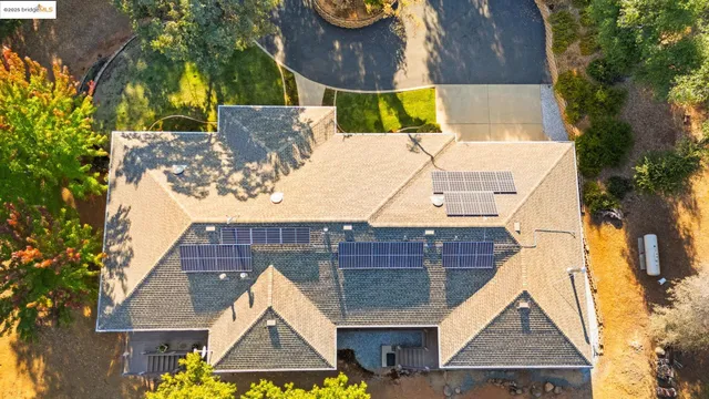 a view of swimming pool in front of house