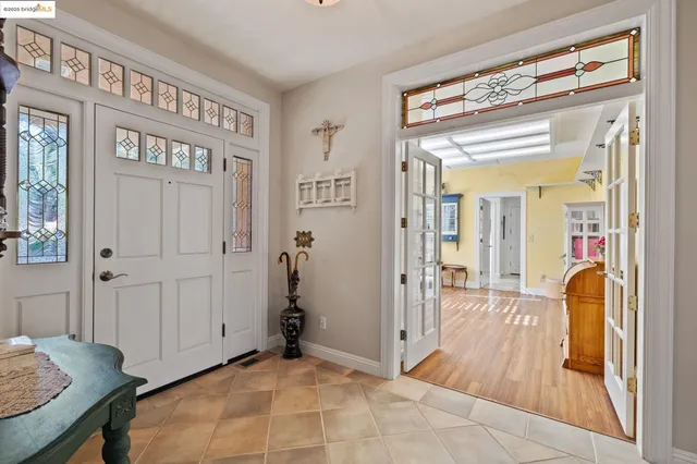 a view of a hallway with furniture and a livingroom view