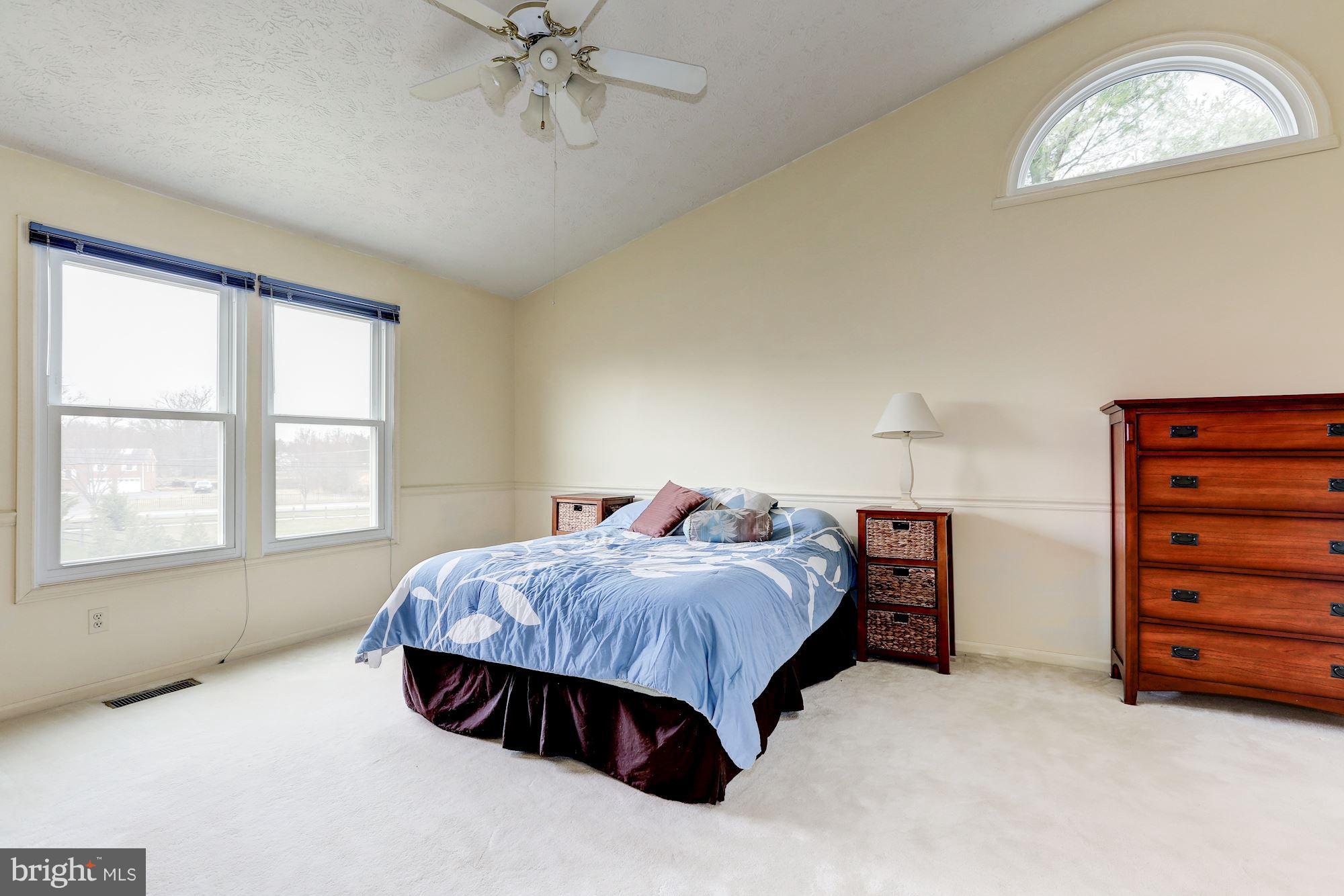 17005 Spates Hill Road Poolesville, MD 20837 - Photo 12 of 25 a bedroom with a bed and a window