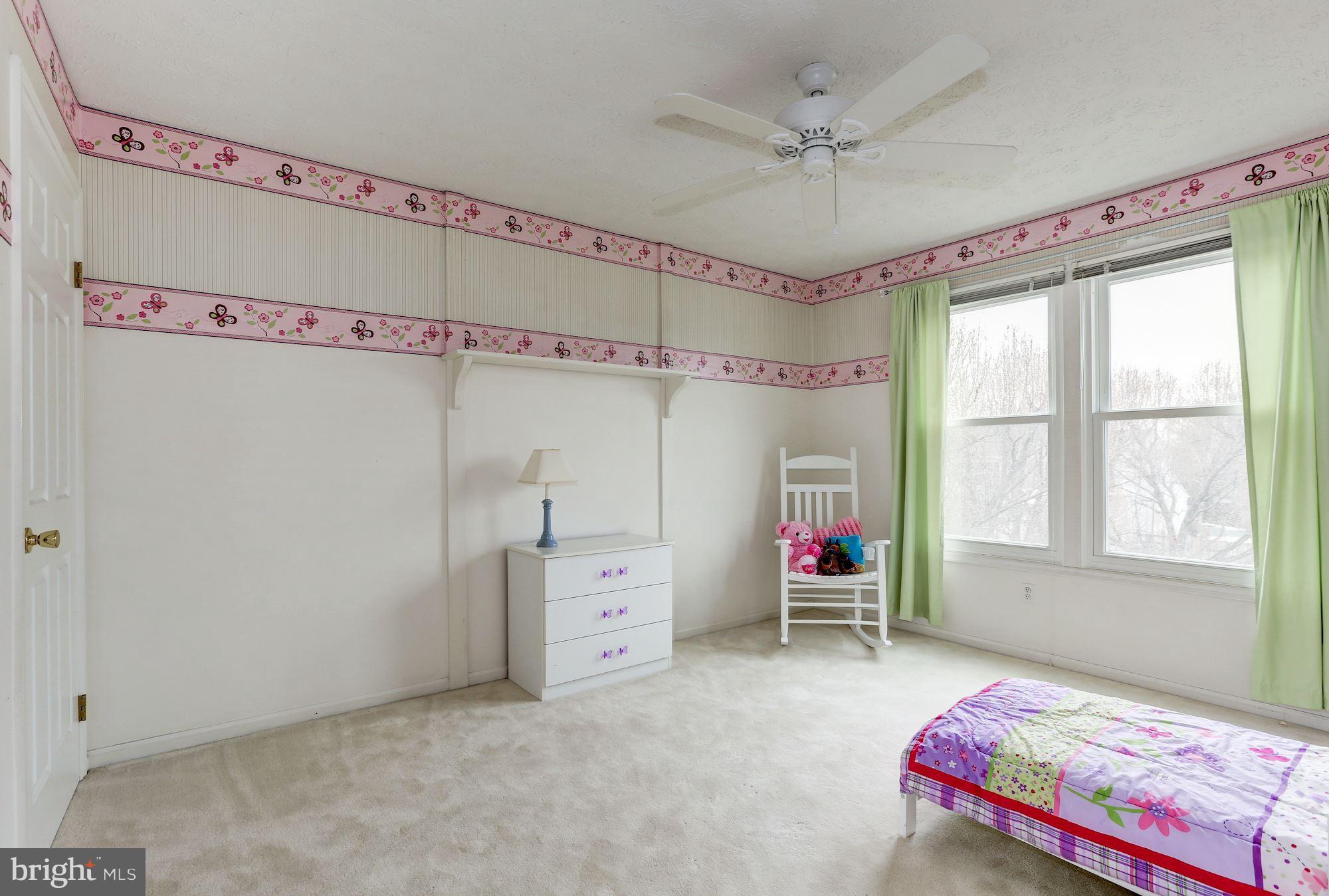 17005 Spates Hill Road Poolesville, MD 20837 - Photo 16 of 25 a bedroom with bed and windows