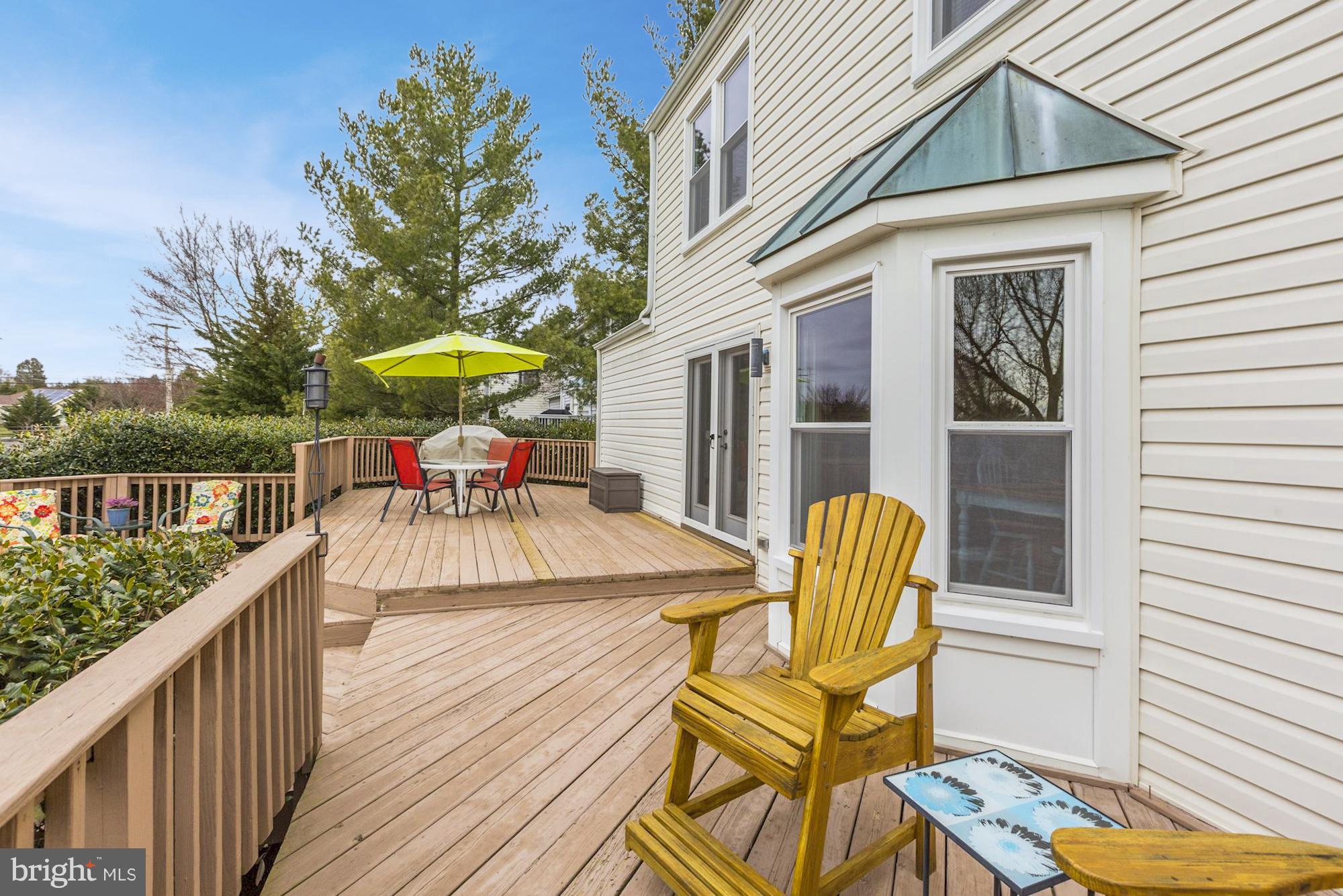 17005 Spates Hill Road Poolesville, MD 20837 - Photo 22 of 25 a balcony with table and chairs