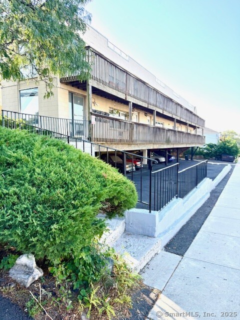a view of a house with wooden fence